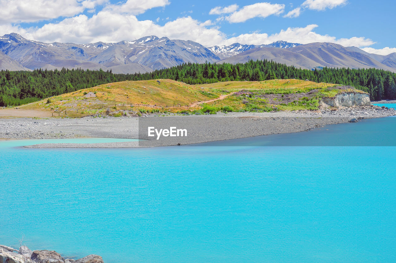 water, mountain, scenics - nature, beauty in nature, land, environment, landscape, nature, travel destinations, sky, lake, travel, blue, tranquil scene, tranquility, mountain range, turquoise colored, cloud, body of water, tree, tourism, idyllic, reservoir, pinaceae, vacation, plant, no people, trip, day, coniferous tree, lagoon, beach, pine tree, holiday, non-urban scene, outdoors, forest, pine woodland, island, bay, mountain peak, snow, summer, crater lake, coastline, rock, cold temperature