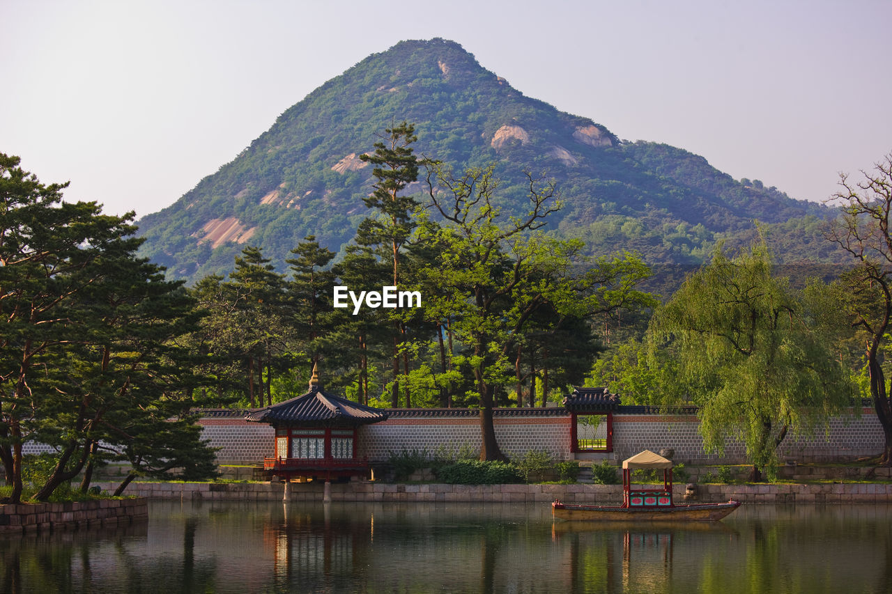 Photo of tea house and lake at the royal palace gyeongbokgung / seoul