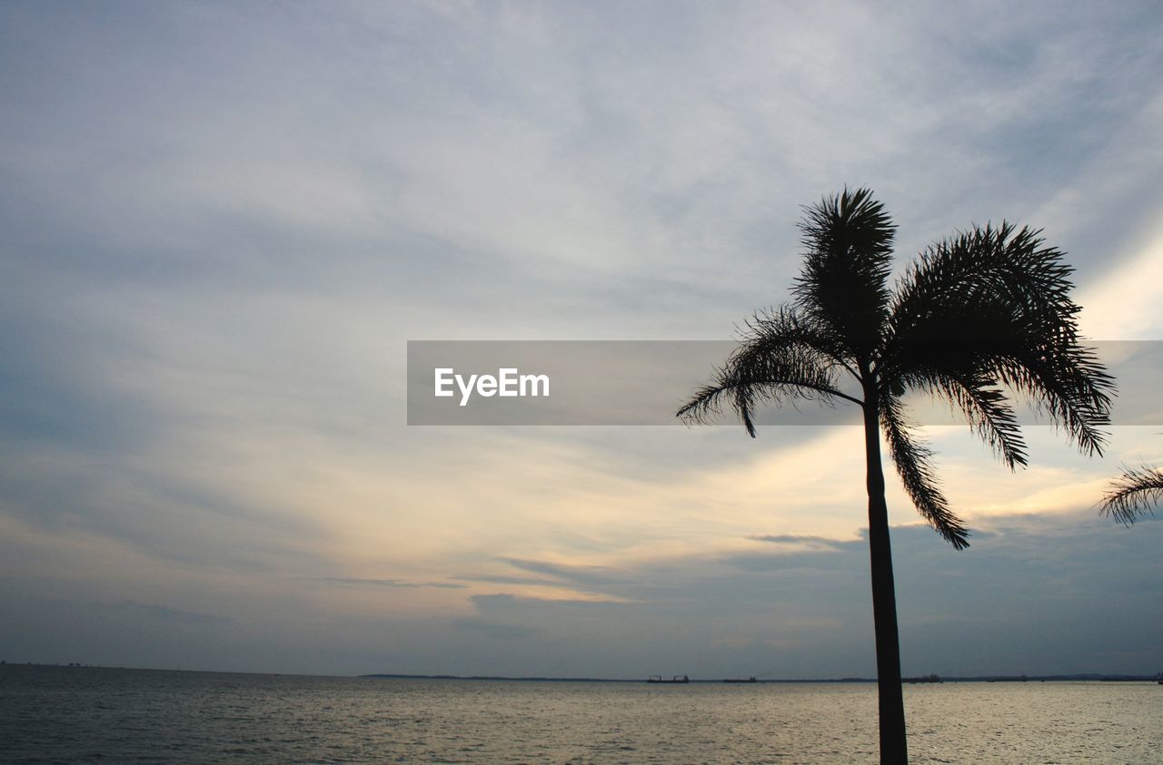 Scenic view of sea against sky at sunset