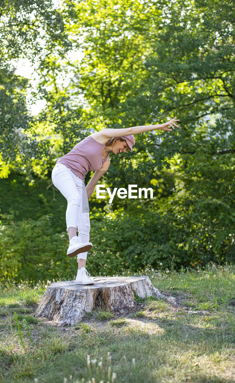 low section of woman standing on field