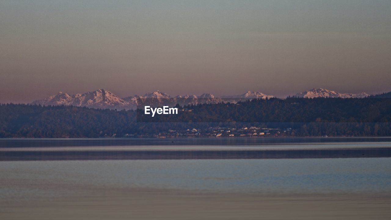 Scenic view of sea against sky during sunrise