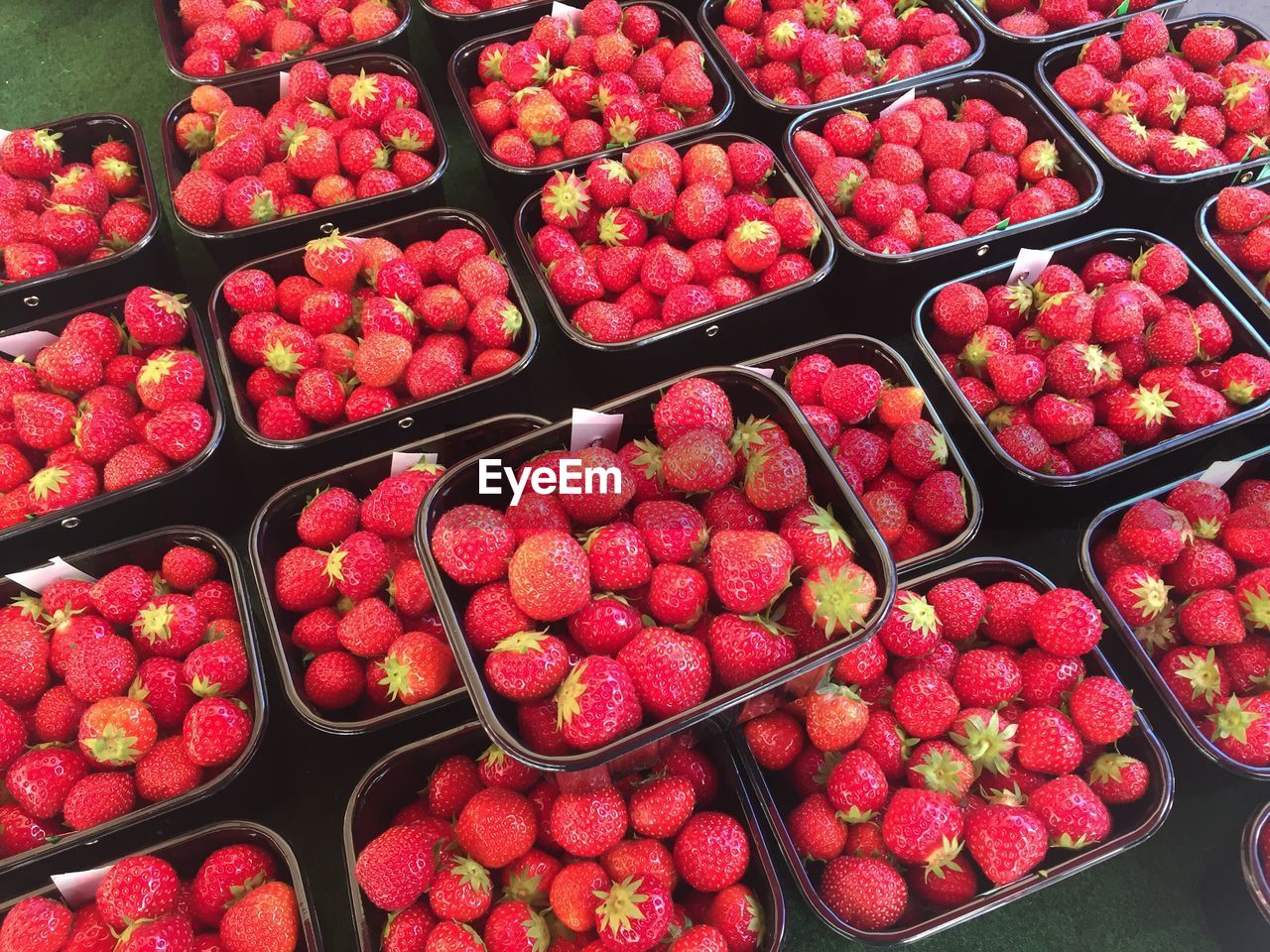 HIGH ANGLE VIEW OF STRAWBERRIES IN MARKET FOR SALE