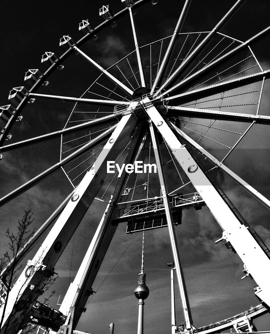 Low angle view of ferris wheel against sky