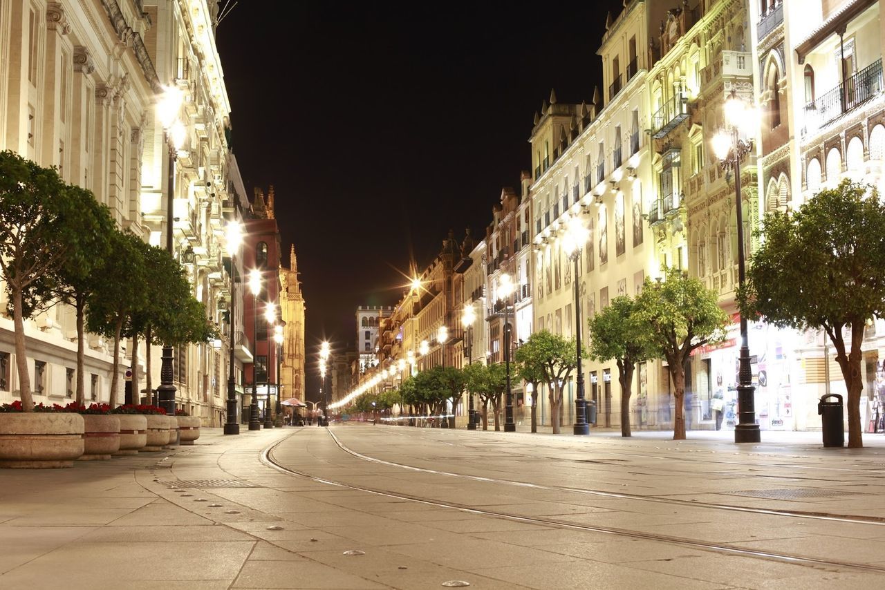 Surface level of empty road along buildings