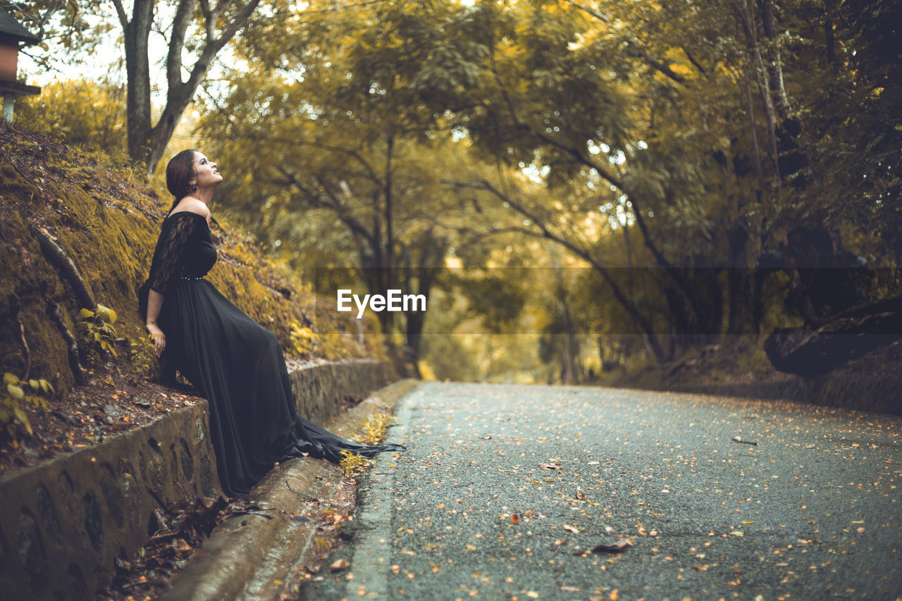 Woman looking up outdoors