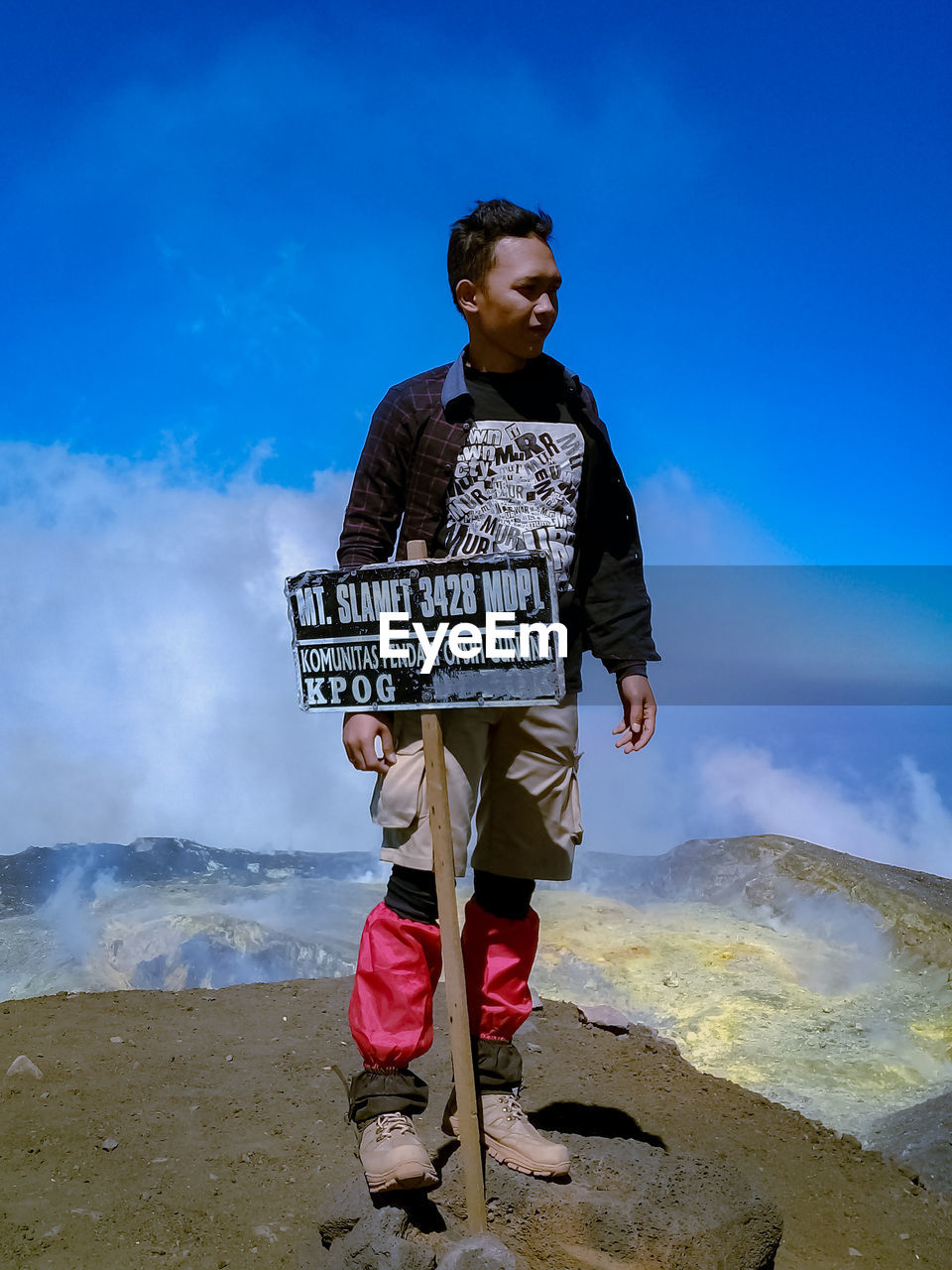 FULL LENGTH OF BOY STANDING ON LAND