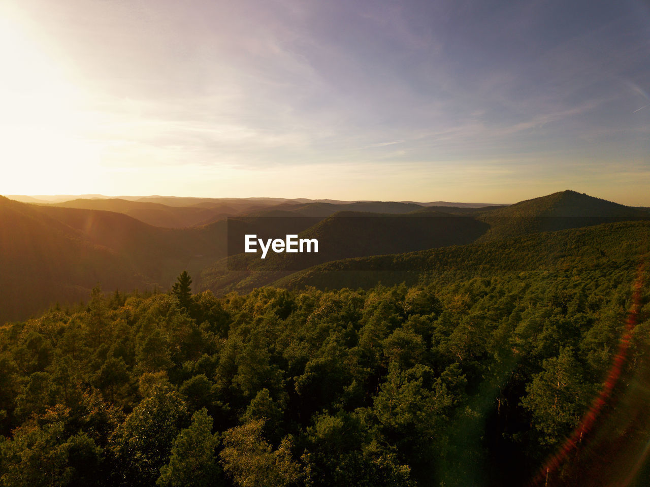 Scenic view of landscape against sky during sunset