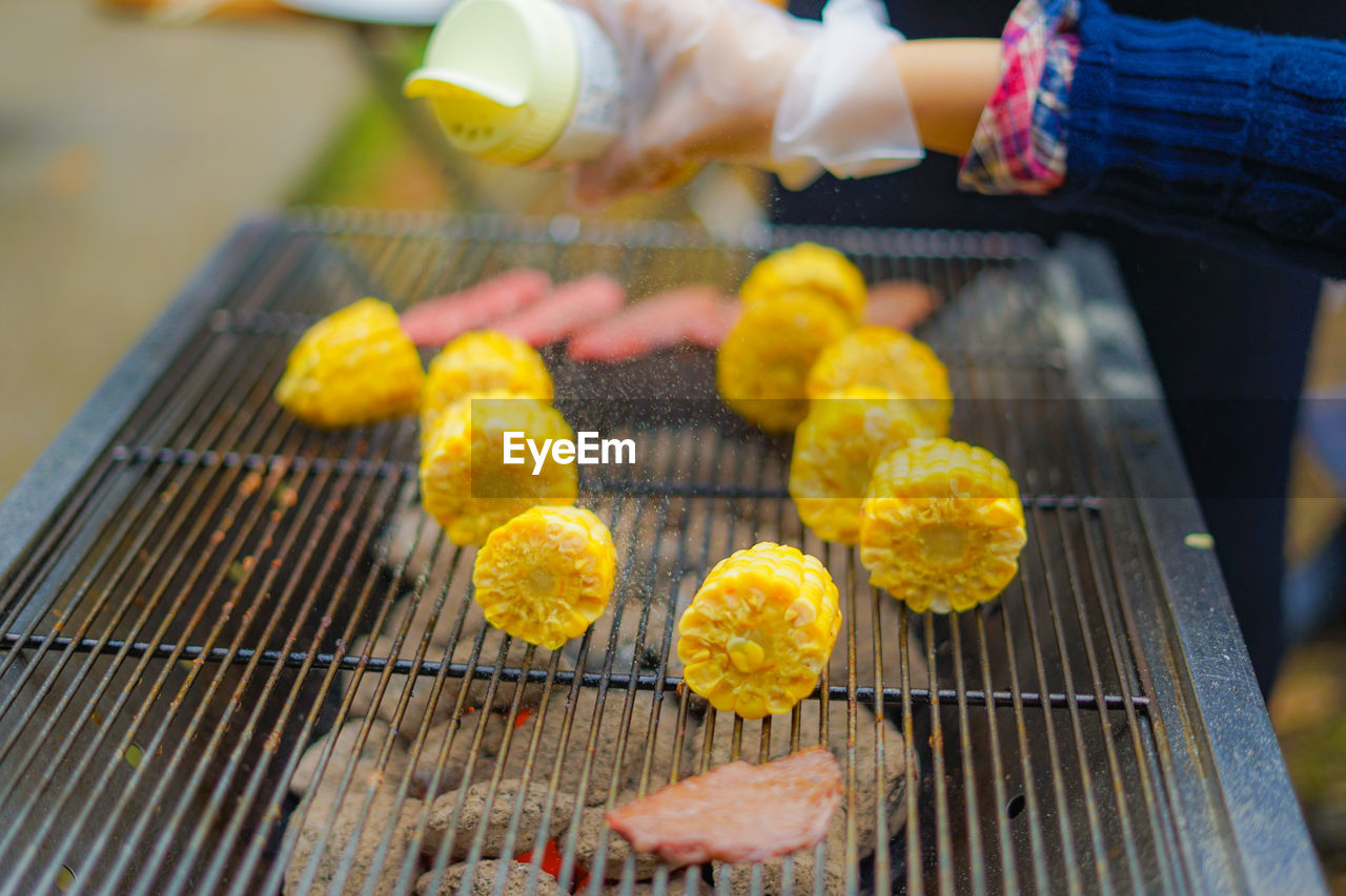 cropped hand of person preparing food