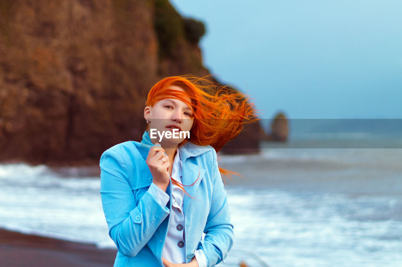 Portrait of young woman at beach