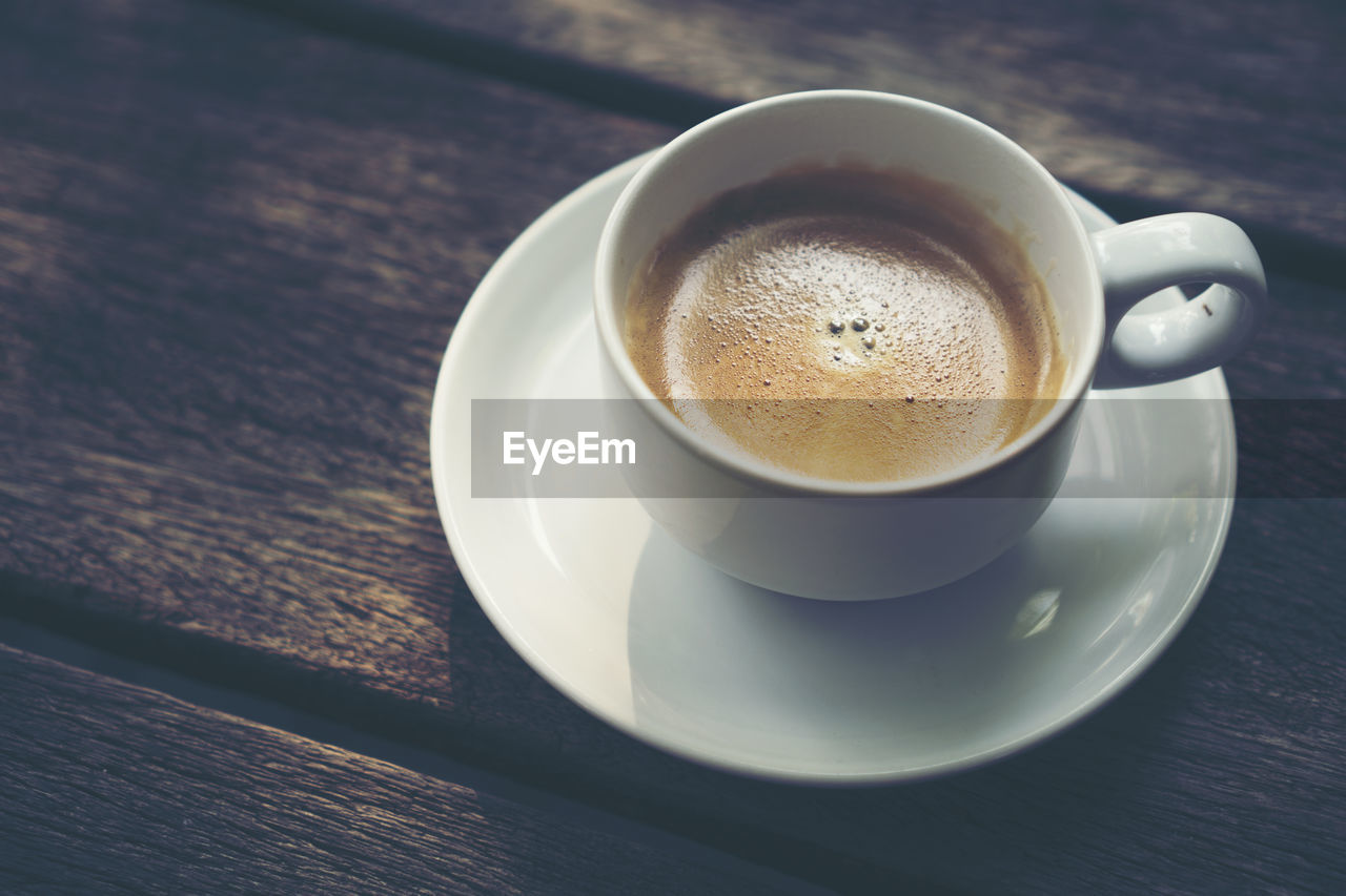 CLOSE-UP OF COFFEE ON TABLE