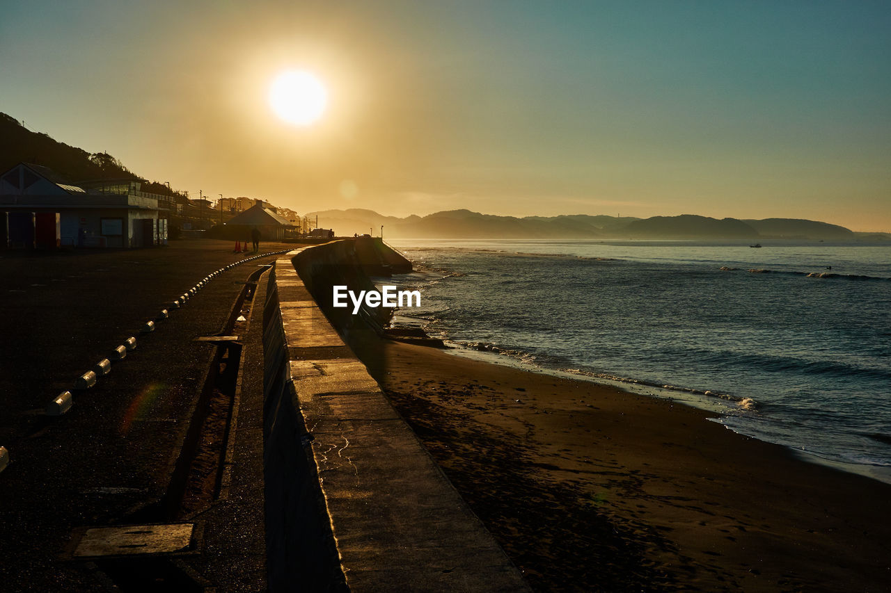 Scenic view of sea against sky during sunrise