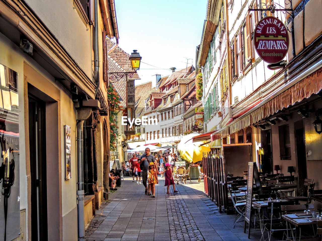 GROUP OF PEOPLE WALKING IN CITY