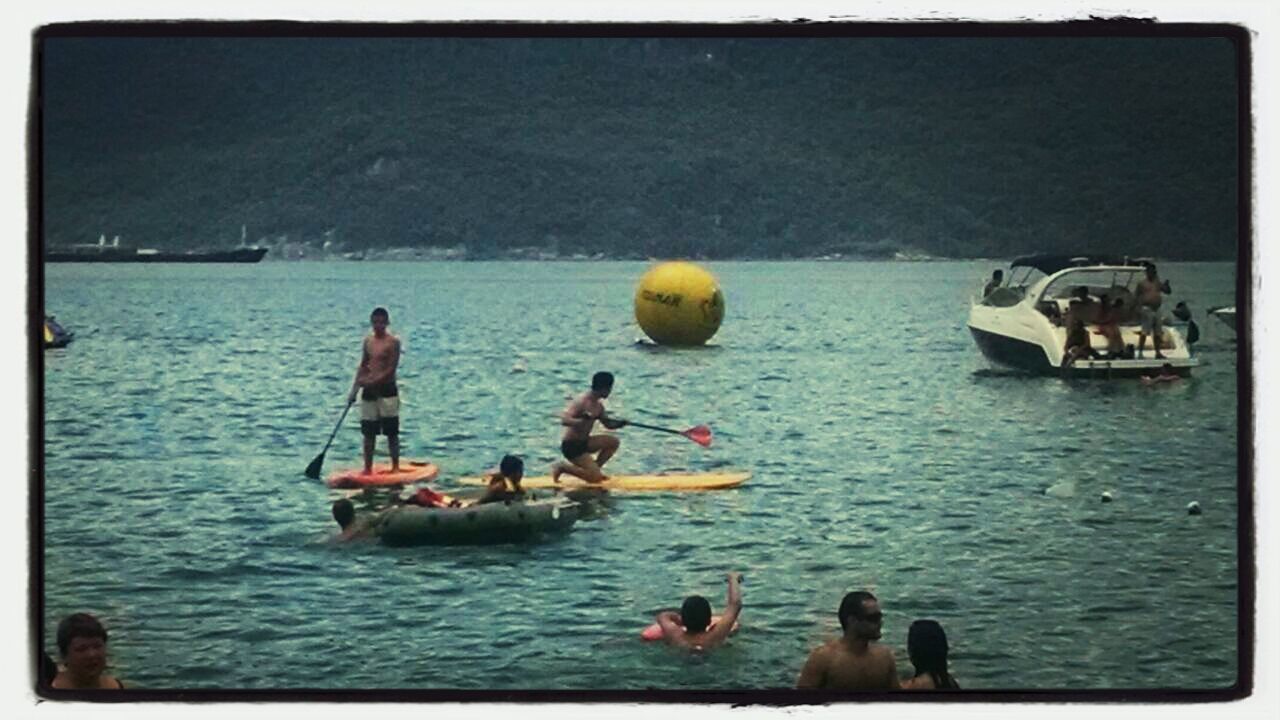 PEOPLE ON BOAT IN SEA