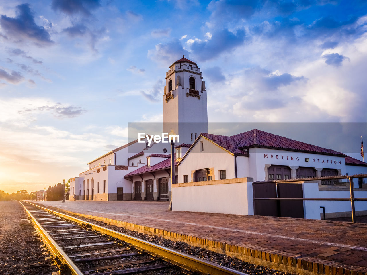 Railroad station against sky in city