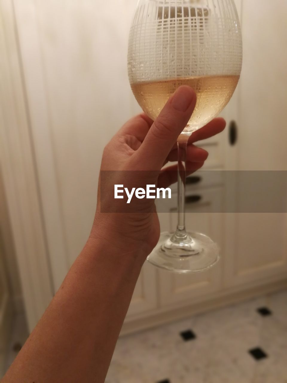 Close-up of hand holding wine glass