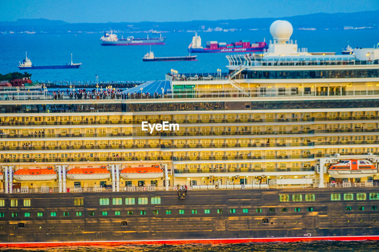 cruise ship, ship, ocean liner, architecture, transportation, vehicle, watercraft, building exterior, water, passenger ship, built structure, nautical vessel, city, mode of transportation, harbor, motor ship, travel destinations, sea, nature, travel, sky, building, no people, naval architecture, boat, freight transport, outdoors, pier, container ship, business, industry, tourism, port, stadium, cruise, business finance and industry