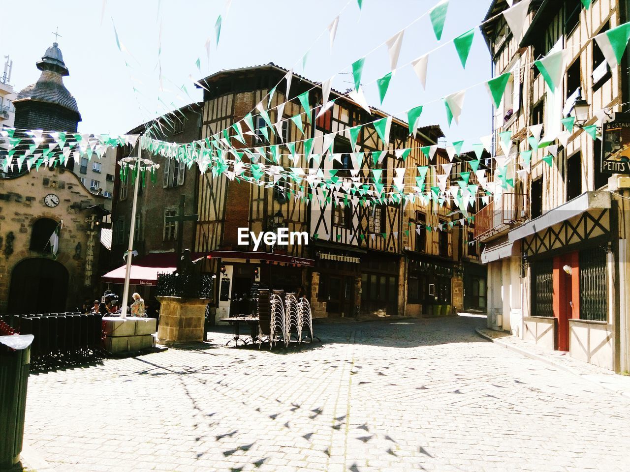 Buntings on buildings during sunny day