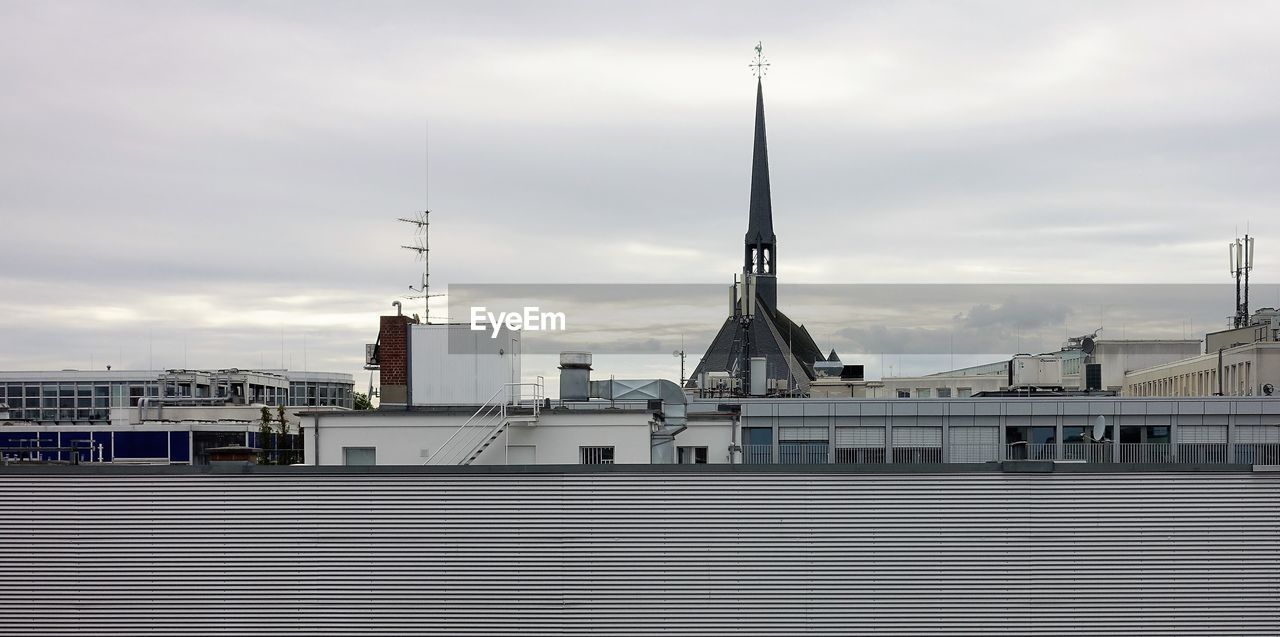 View of buildings against cloudy sky