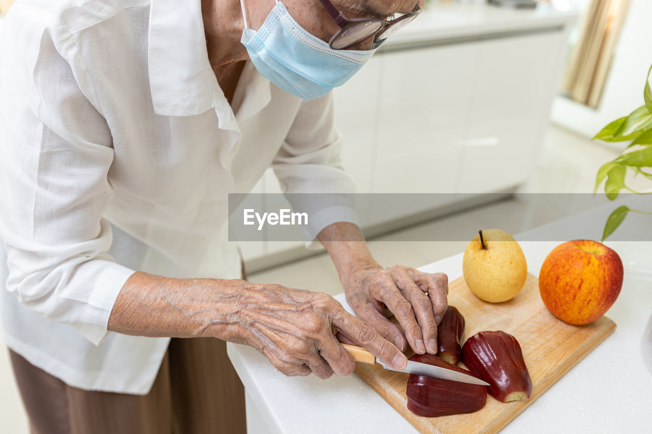 Midsection of chef preparing food