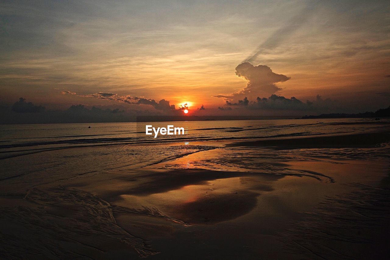 Scenic view of sea against sky at sunset