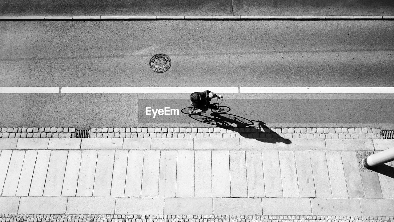 Aerial view of man riding bicycle on road