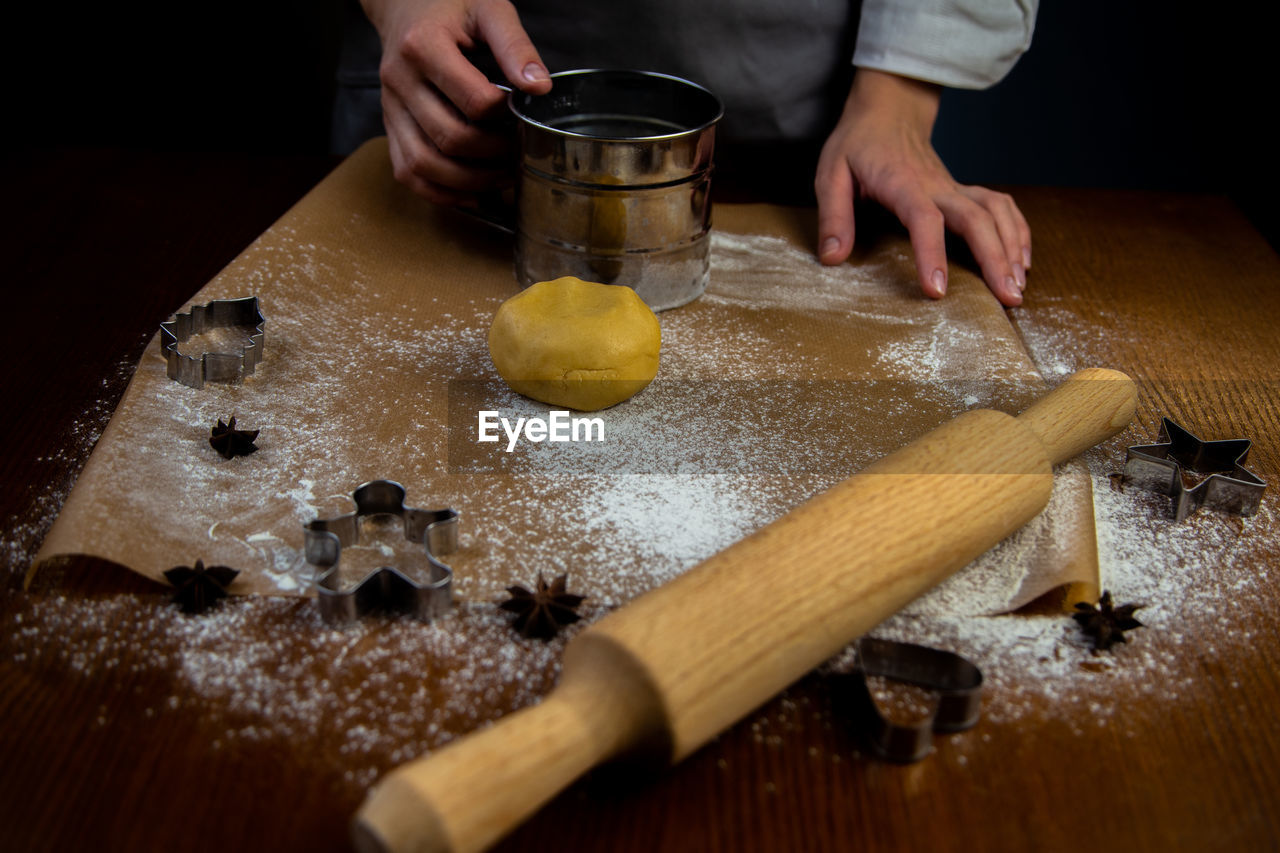 cropped hands of woman preparing food on table