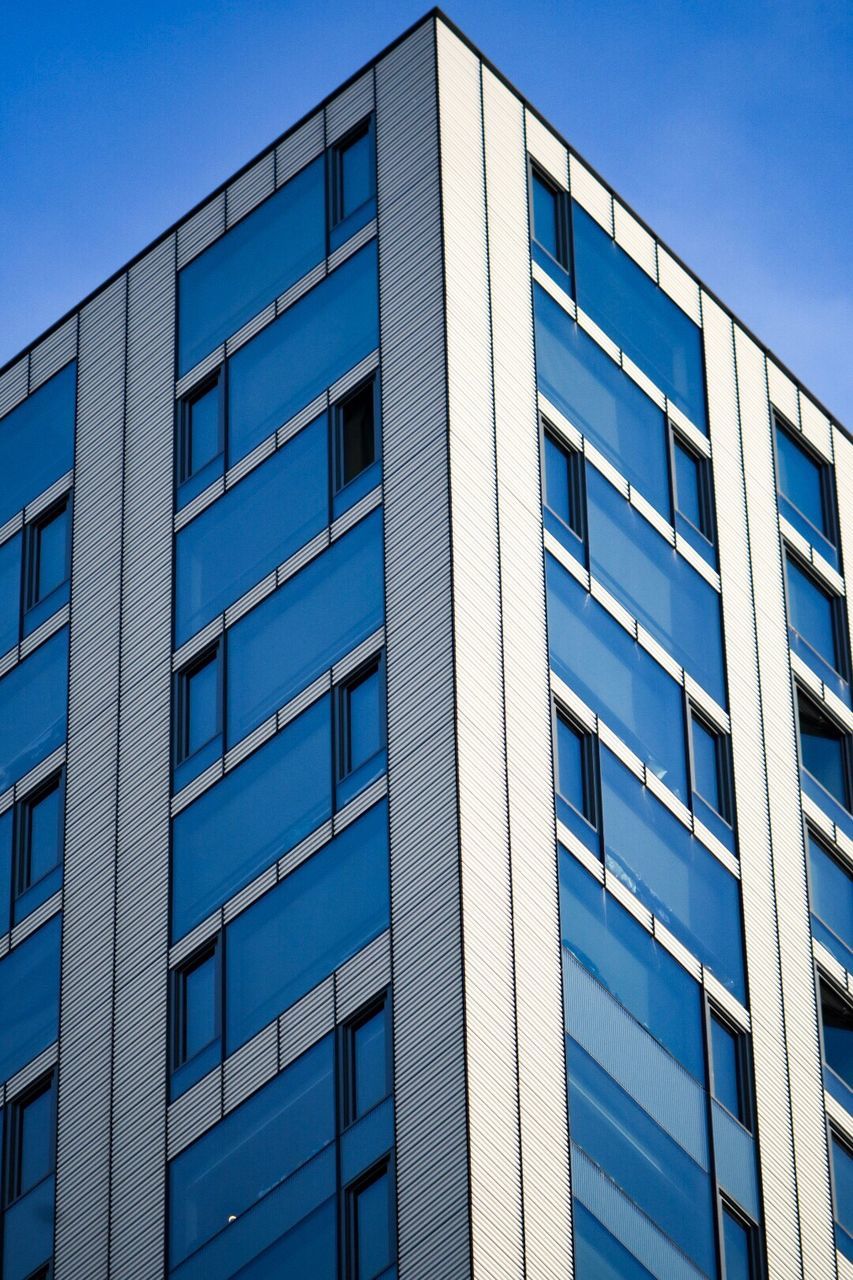 OFFICE BUILDING AGAINST BLUE SKY