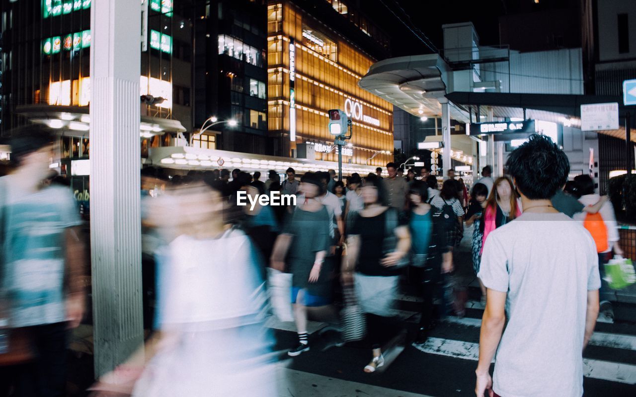 People walking on street in city