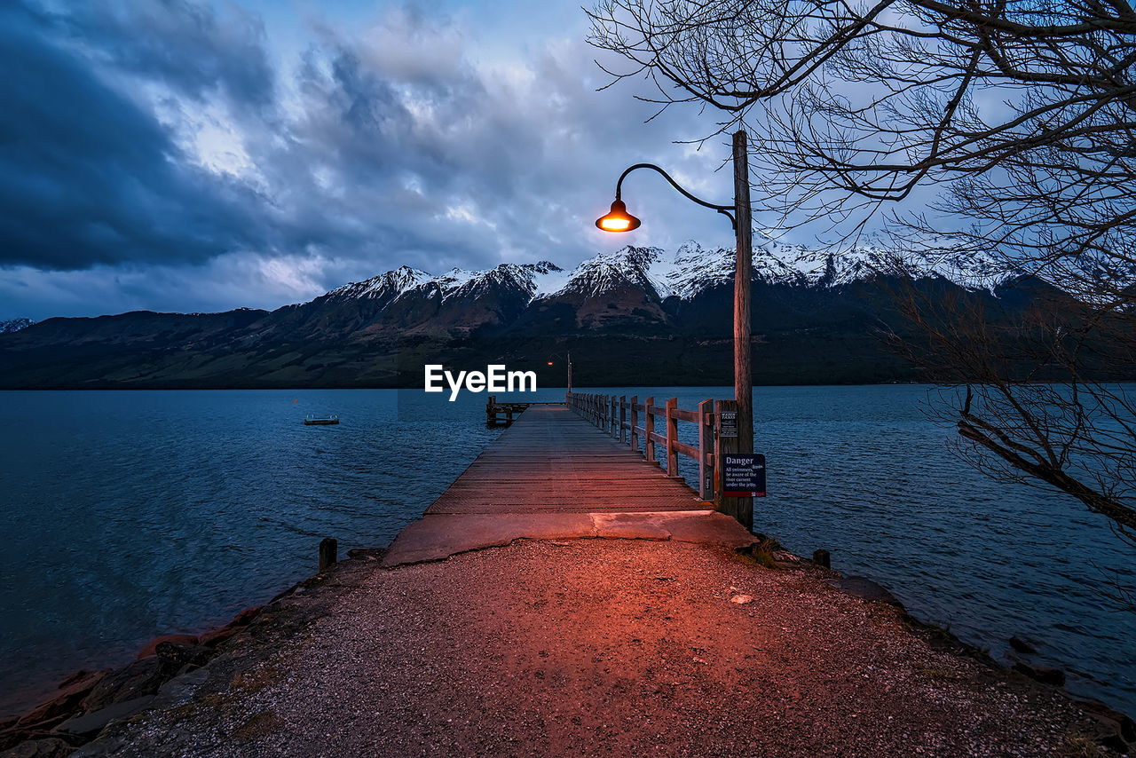 Scenic view of lake against sky during winter