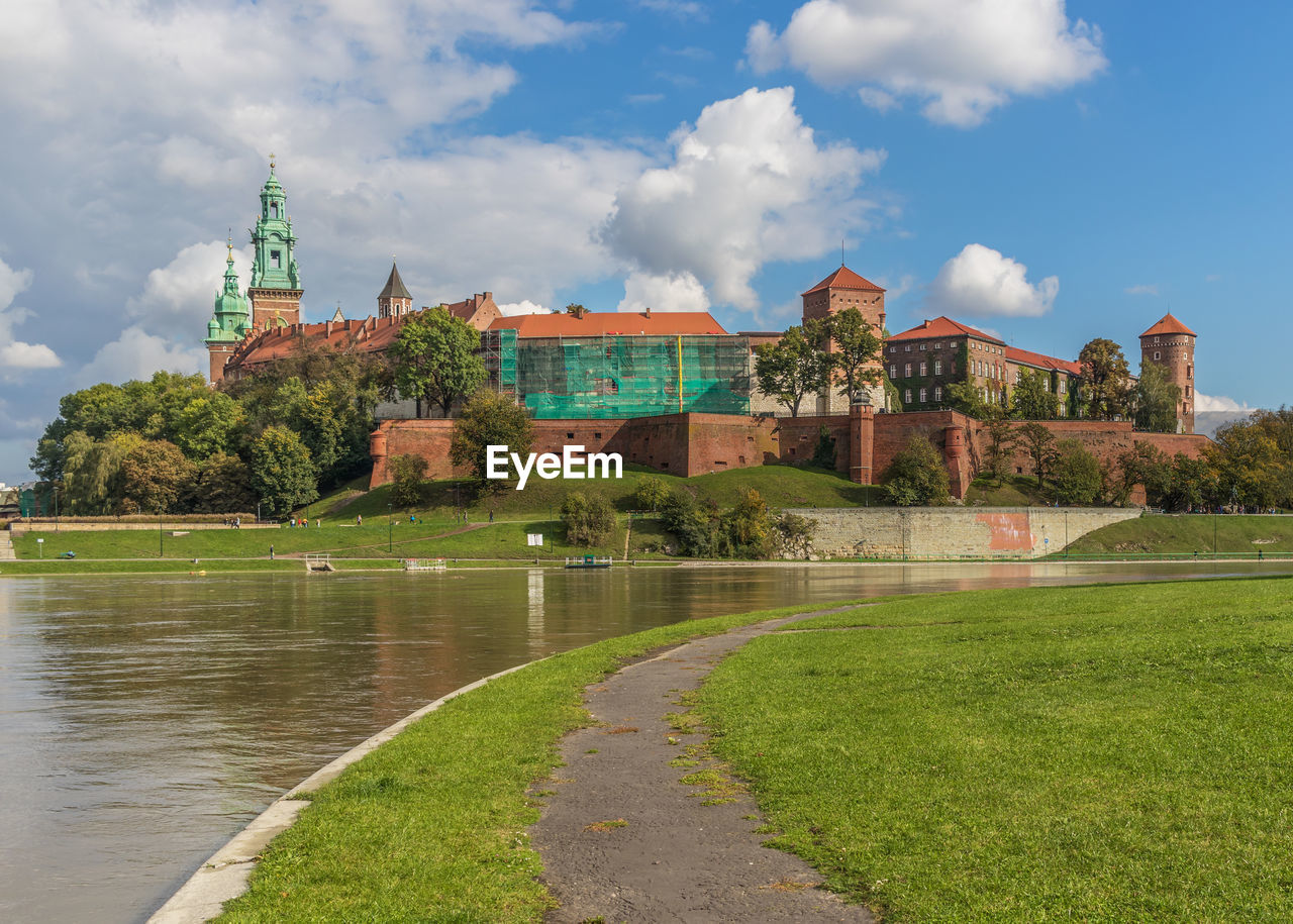 VIEW OF BUILDINGS BY RIVER