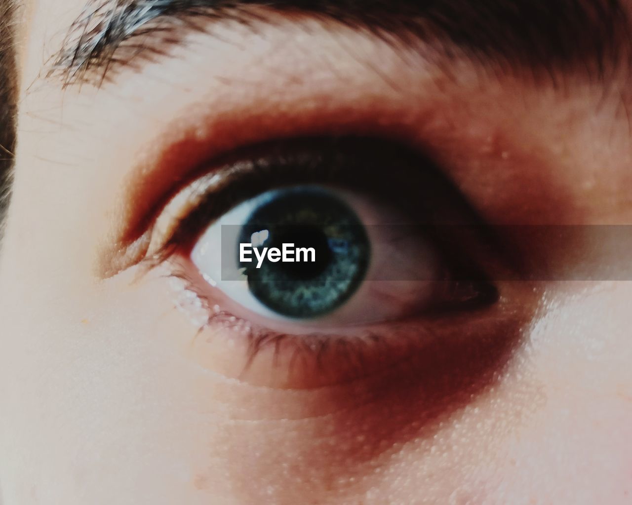 EXTREME CLOSE-UP OF HUMAN EYE