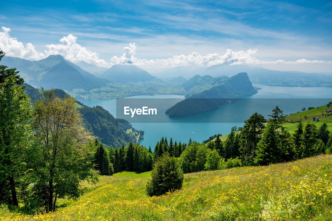 Scenic view of landscape and mountains against sky