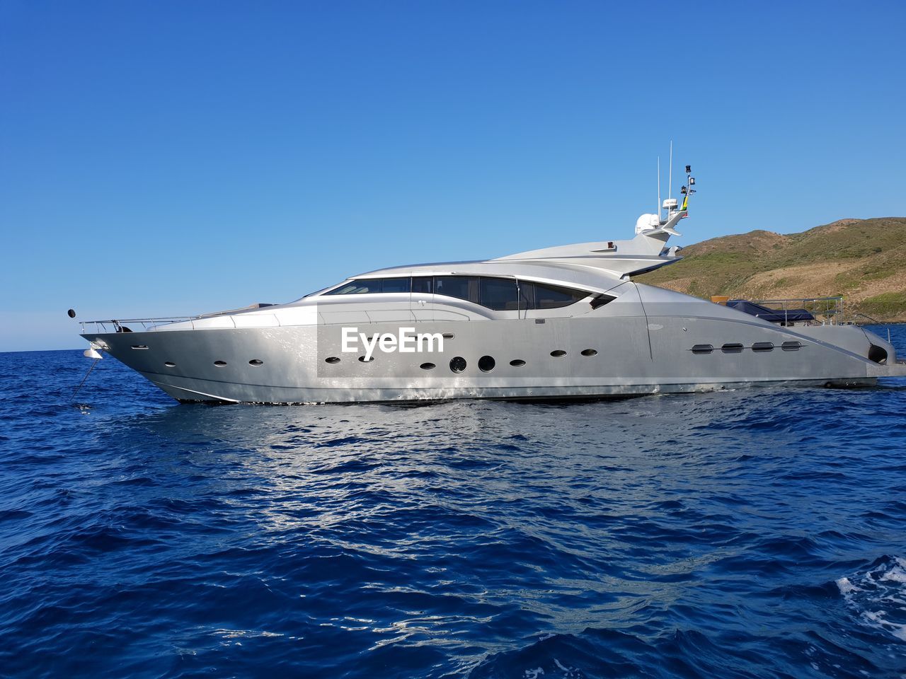 NAUTICAL VESSEL ON SEA AGAINST CLEAR BLUE SKY