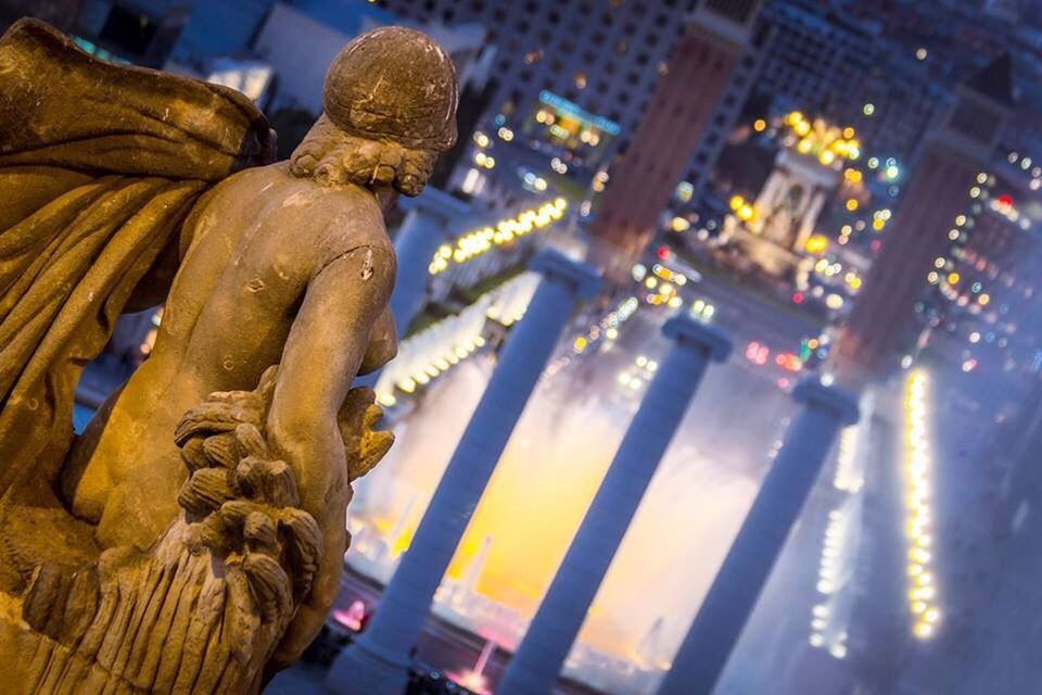 statue, sculpture, human representation, no people, illuminated, architecture, travel destinations, outdoors, gold colored, night, gargoyle, close-up, city