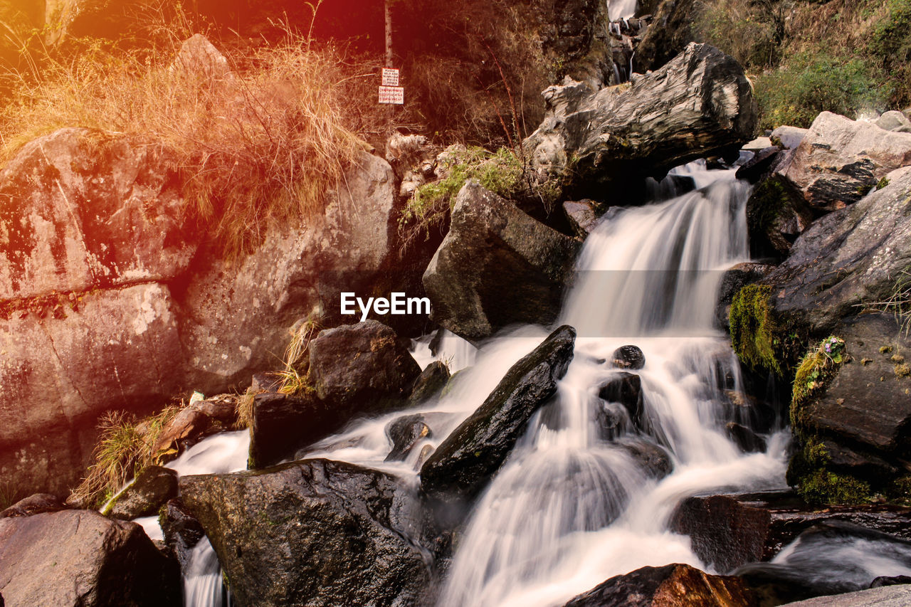 SCENIC VIEW OF WATERFALL