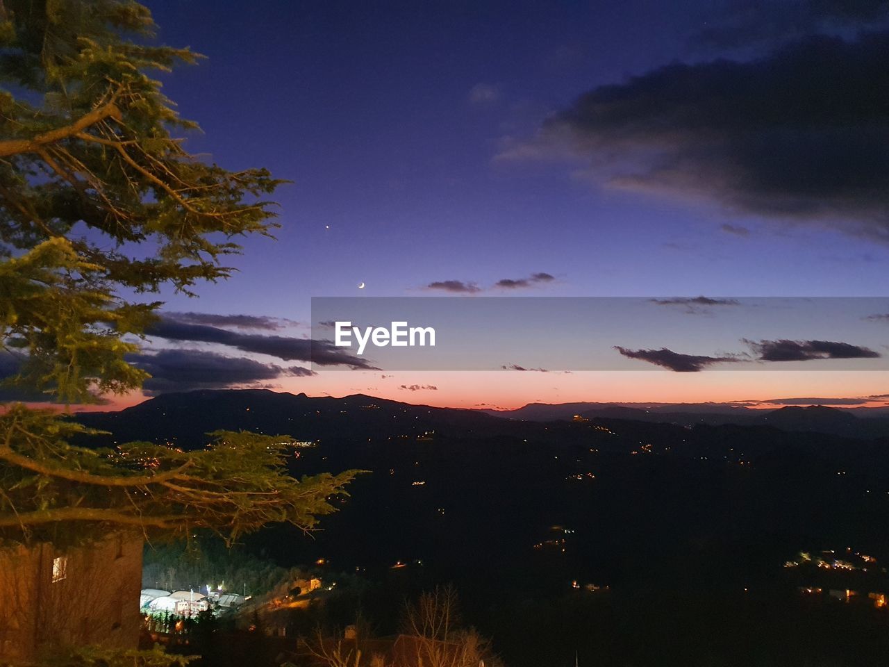 SCENIC VIEW OF LANDSCAPE AGAINST SKY AT NIGHT