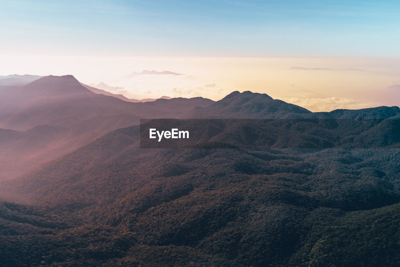 Scenic view of mountains against sky during sunset