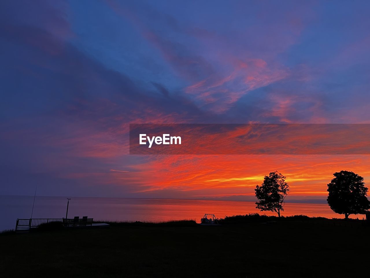 sky, sunset, beauty in nature, cloud, scenics - nature, silhouette, afterglow, horizon, nature, tranquility, tranquil scene, landscape, land, environment, orange color, plant, dawn, tree, no people, red sky at morning, dramatic sky, idyllic, outdoors, evening, sea, water, non-urban scene, travel destinations