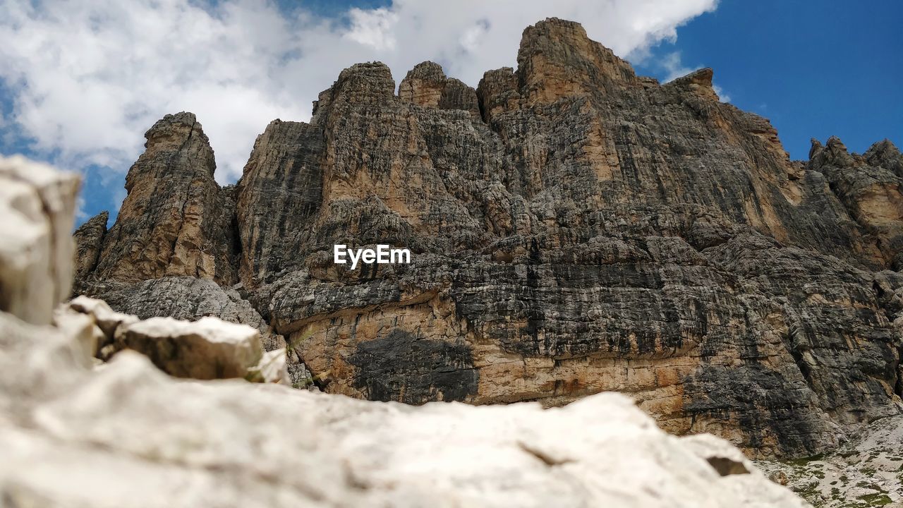 Low angle view of rock formations against sky