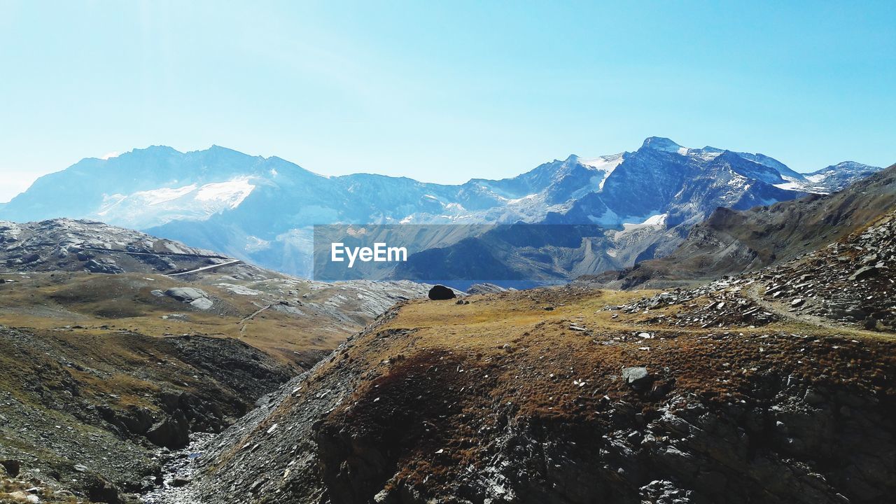 Scenic view of snowcapped mountains against sky