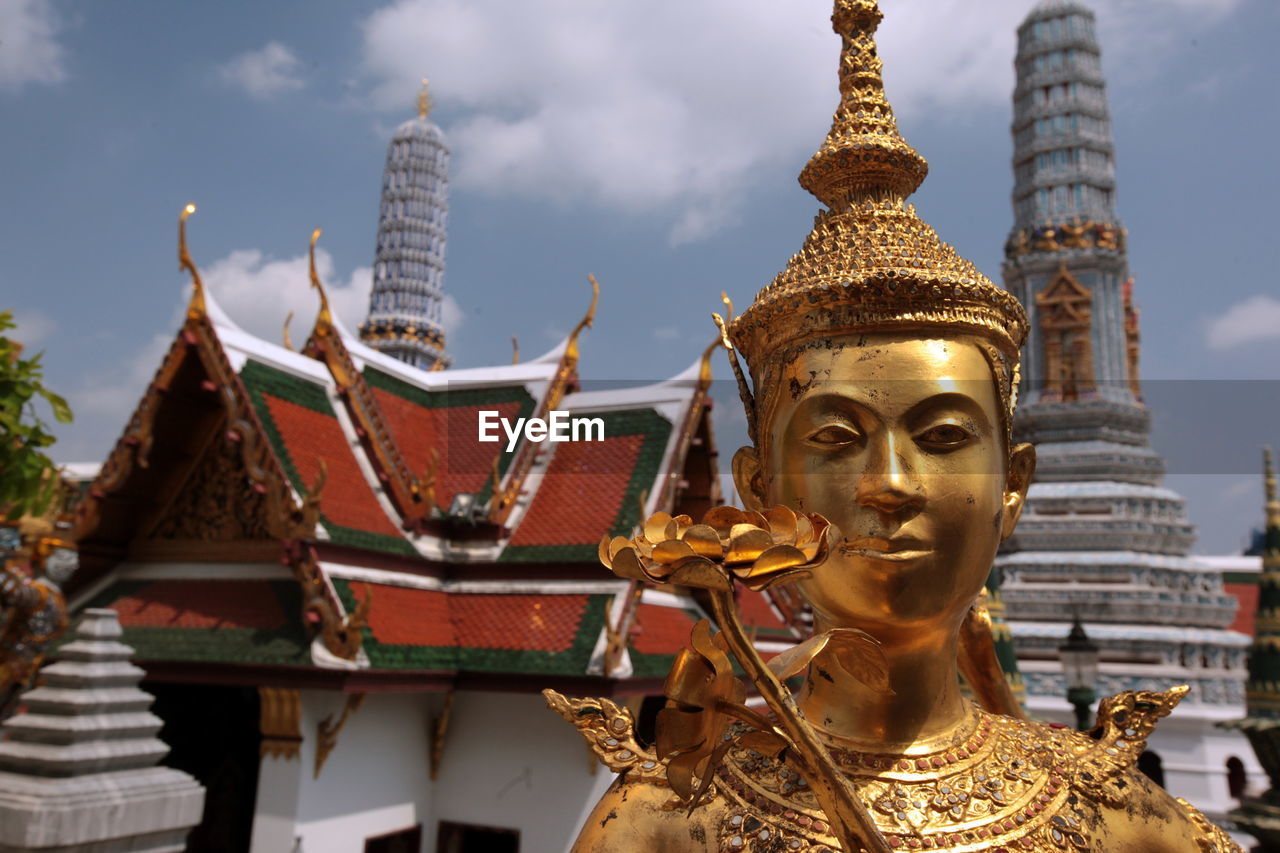 Golden kinnara statue at wat phra kaeo