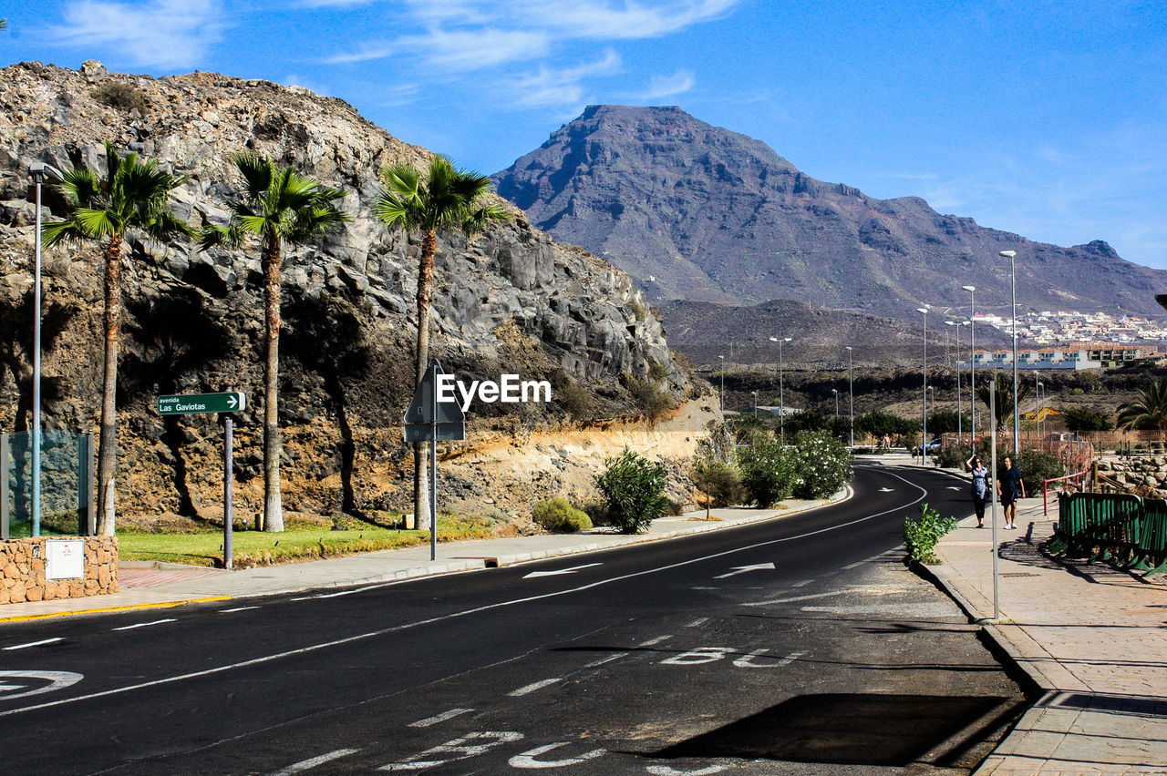 Empty road passing through mountain