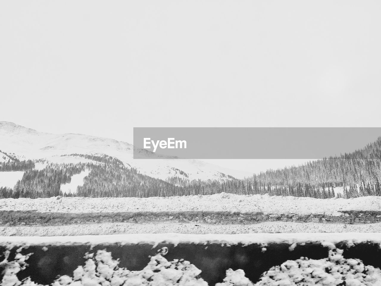 FROZEN LANDSCAPE AGAINST CLEAR SKY