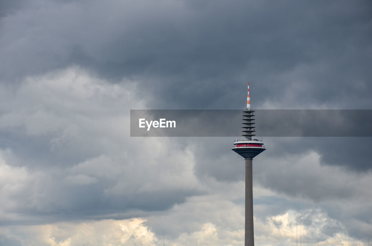 LOW ANGLE VIEW OF TOWER AGAINST CLOUDY SKY