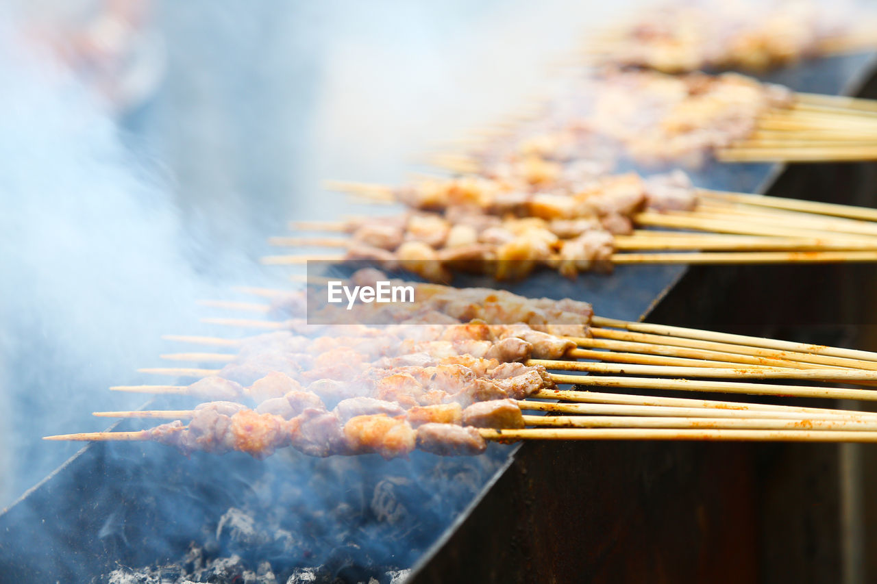 Close-up of meat on barbecue grill