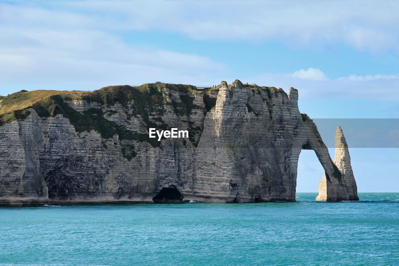 The cliffs of etretat with it natural arch - pont daval - and its needle - aiguille d'etretat -