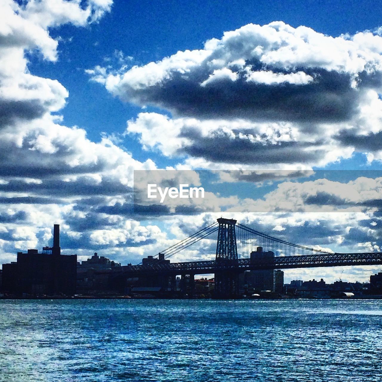 CITYSCAPE AGAINST CLOUDY SKY