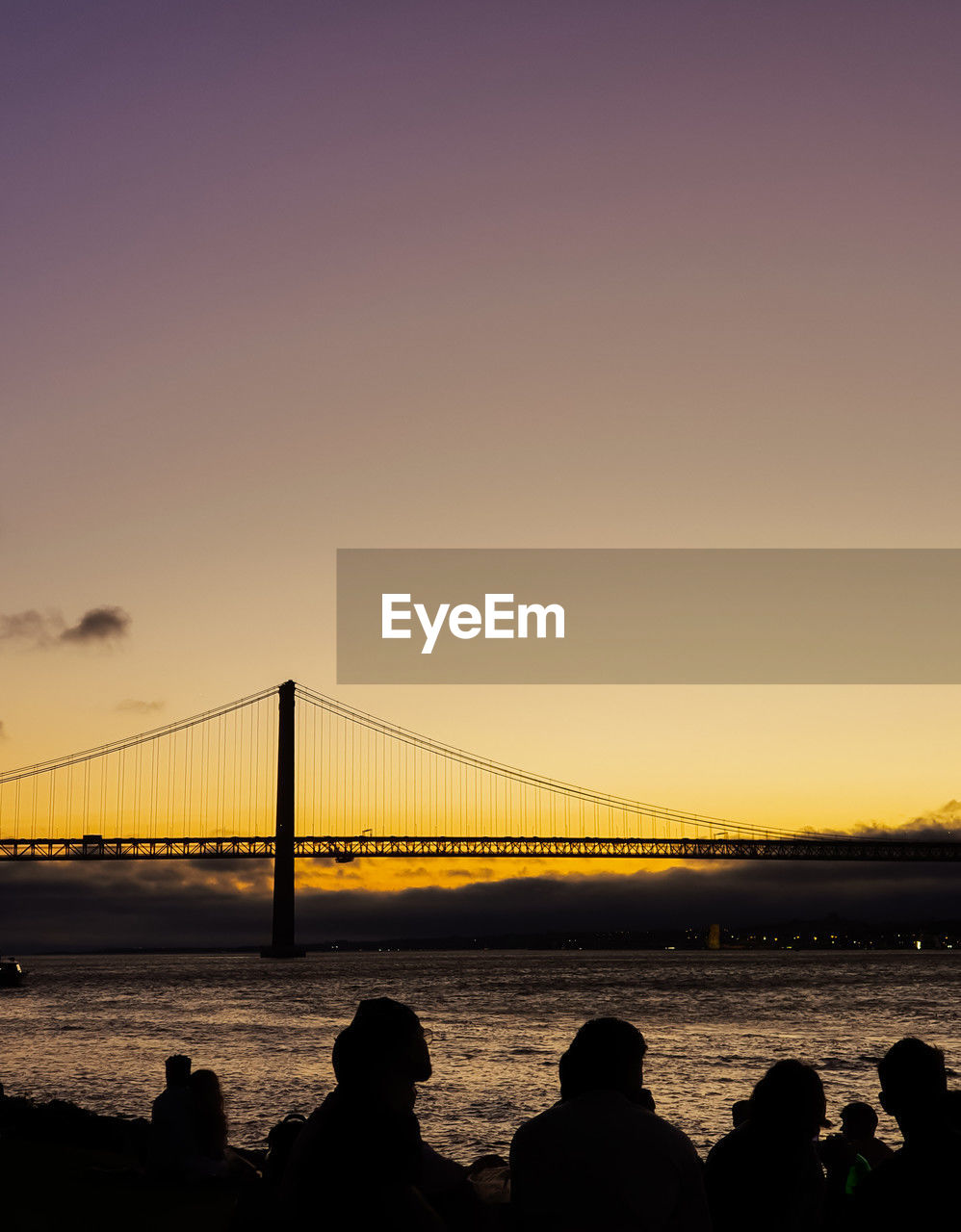 bridge, sky, suspension bridge, water, dusk, architecture, built structure, travel destinations, sunset, evening, horizon, nature, silhouette, transportation, engineering, tourism, sea, travel, city, copy space, cloud, bay, beauty in nature, bay of water, outdoors, reflection, cityscape, sunlight, scenics - nature, clear sky, city life, urban skyline, cable-stayed bridge, holiday, trip
