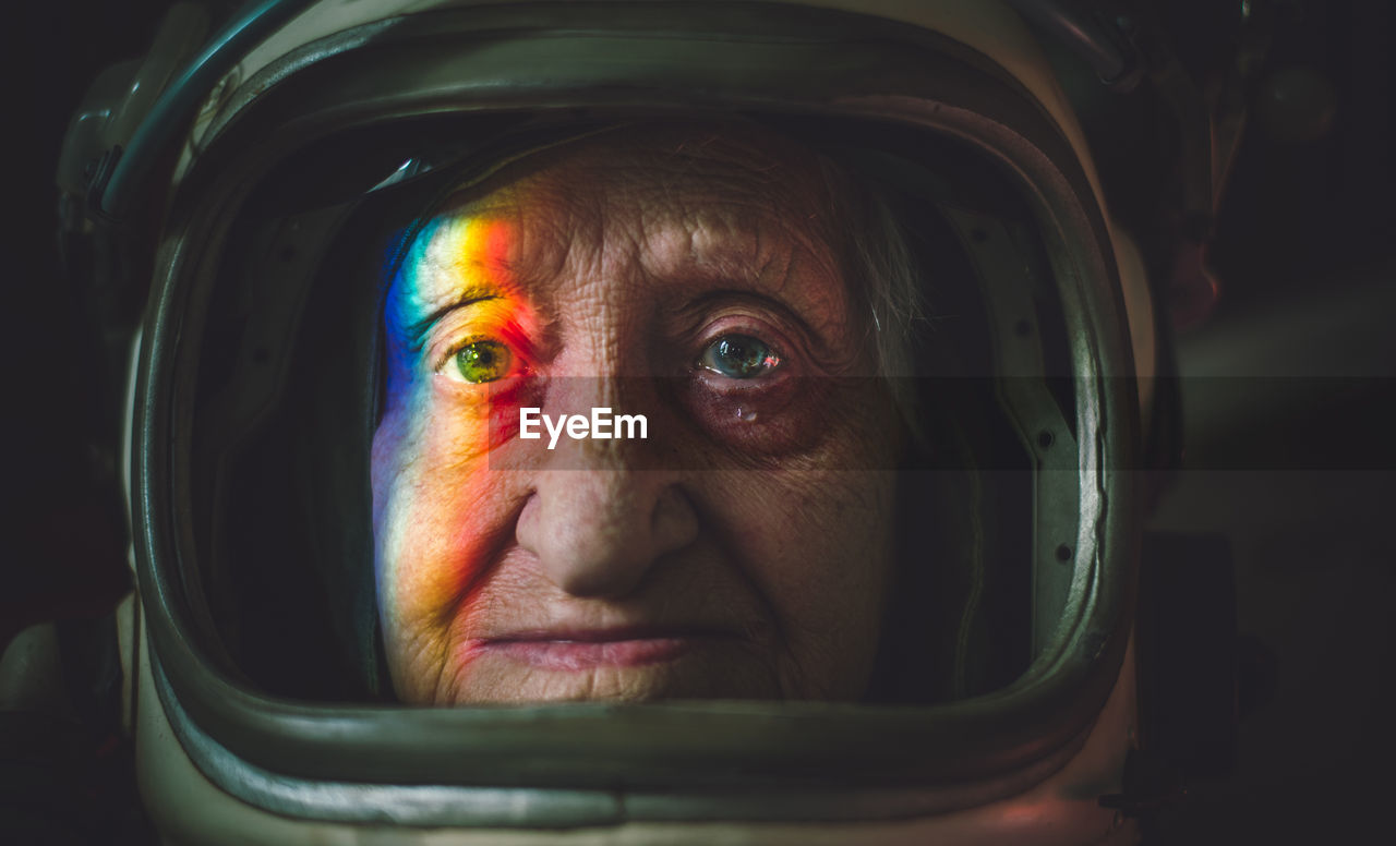 Close-up portrait senior woman wearing space suit