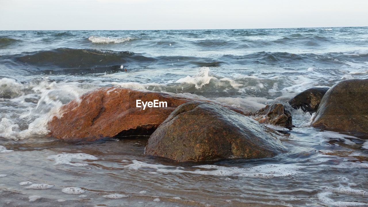 Wave splashing on rocks at baltic sea